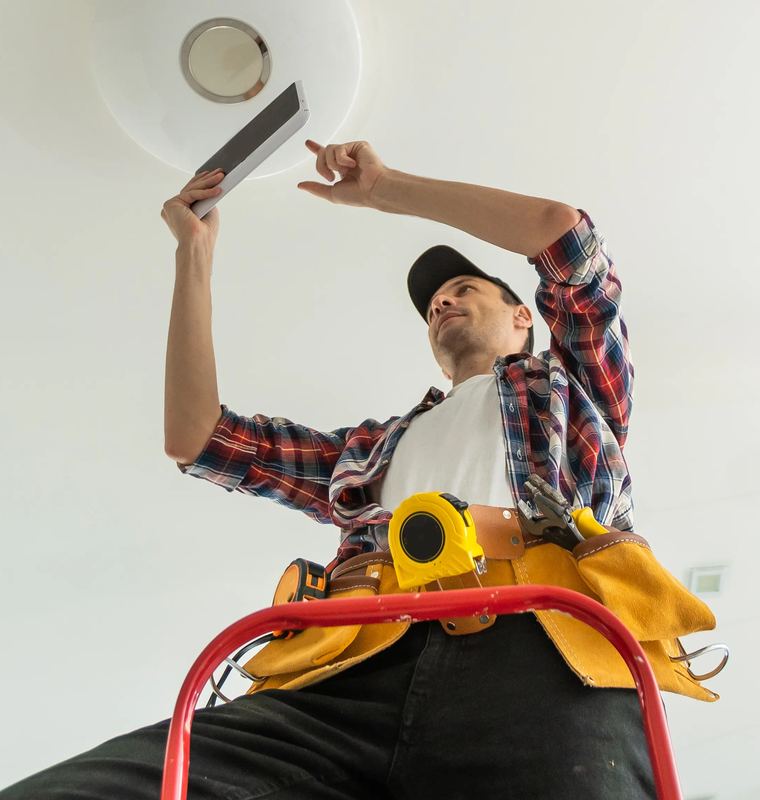 Electrical work being carried out on a lighting circuit